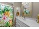 Bright bathroom featuring white vanity with floral shower curtain, offering a clean and vibrant space at 226 Fletcher Ridge Rd, Timberlake, NC 27583