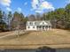 Beautiful home with a sprawling front lawn, surrounded by mature trees at 226 Fletcher Ridge Rd, Timberlake, NC 27583