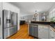Modern kitchen features stainless steel appliances, custom cabinets and hardwood flooring at 226 Fletcher Ridge Rd, Timberlake, NC 27583