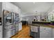 Open kitchen featuring stainless steel appliances and hardwood flooring, offering a modern feel at 226 Fletcher Ridge Rd, Timberlake, NC 27583