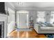 Inviting living room featuring hardwood floors, fireplace, and ample natural light at 226 Fletcher Ridge Rd, Timberlake, NC 27583