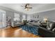 Bright and airy living room with hardwood floors, ceiling fan, and comfortable seating at 226 Fletcher Ridge Rd, Timberlake, NC 27583