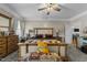 Spacious bedroom featuring a wooden bench, ceiling fan and plenty of natural light at 226 Fletcher Ridge Rd, Timberlake, NC 27583