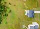 Aerial view of a large lot with lush green grass, mature trees, and a sprawling residence at 233 Berg St, Smithfield, NC 27577