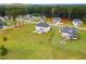 Wide aerial view of neighborhood homes surrounded by greenery and mature trees at 233 Berg St, Smithfield, NC 27577