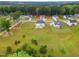 Aerial view of a home in a lush green neighborhood with large lots and mature trees at 233 Berg St, Smithfield, NC 27577