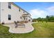Expansive backyard featuring a concrete patio with several seating areas and manicured lawn at 233 Berg St, Smithfield, NC 27577