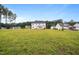 The backyard showcases a sprawling lawn, offering generous space and a peaceful atmosphere at 233 Berg St, Smithfield, NC 27577