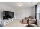Bonus room with large TV, leather seating and natural light at 233 Berg St, Smithfield, NC 27577