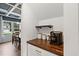 Dining nook with coffered ceiling, built in coffee bar, and a view to the neighborhood at 233 Berg St, Smithfield, NC 27577
