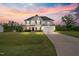 Beautiful two-story home featuring a manicured lawn and a two-car garage at 233 Berg St, Smithfield, NC 27577