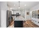 Modern kitchen with stainless steel appliances, an island, and hardwood floors at 233 Berg St, Smithfield, NC 27577