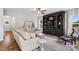 Cozy living room with a large sectional sofa, a TV, and neutral decor at 233 Berg St, Smithfield, NC 27577