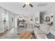 Spacious living room with large sectional couch and view to the kitchen and staircase at 233 Berg St, Smithfield, NC 27577