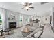Cozy living room with fireplace, large sectional couch, and view into the kitchen area at 233 Berg St, Smithfield, NC 27577