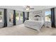 Elegant bedroom with large windows, neutral colors, and decorative accents at 233 Berg St, Smithfield, NC 27577