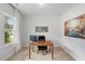 Cozy home office with a large window, desk, and neutral carpet at 233 Berg St, Smithfield, NC 27577
