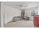 Bright bedroom with a ceiling fan, a vanity and a comfortable seating area at 2429 Follow Me Way, Raleigh, NC 27610
