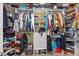 Walk-in closet featuring custom built-in storage solutions for shoes and clothing at 2429 Follow Me Way, Raleigh, NC 27610