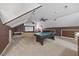 Spacious game room featuring a ping pong table, media screen, and comfortable seating at 2429 Follow Me Way, Raleigh, NC 27610