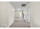 Wide, carpeted hallway provides access to various rooms and storage in the home at 2429 Follow Me Way, Raleigh, NC 27610