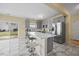 Bright kitchen boasts stainless steel appliances, island with seating, and modern gray cabinetry at 2429 Follow Me Way, Raleigh, NC 27610