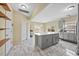 Bright kitchen featuring a large island, stainless steel appliances, and a neutral color scheme at 2429 Follow Me Way, Raleigh, NC 27610