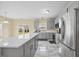 Modern kitchen with stainless steel appliances, a large island, and plenty of counter space at 2429 Follow Me Way, Raleigh, NC 27610