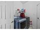 A bright laundry area features a washer, dryer, and useful storage solutions at 2429 Follow Me Way, Raleigh, NC 27610