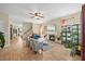 Bright living room with a fireplace, hardwood floors, and large windows offering plenty of natural light at 2429 Follow Me Way, Raleigh, NC 27610