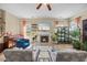 Comfortable living room with fireplace, modern decor, lots of plants, and hardwood floors at 2429 Follow Me Way, Raleigh, NC 27610