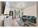 Bright sitting room with comfortable seating, modern decor, and a large window allowing lots of natural light at 2429 Follow Me Way, Raleigh, NC 27610