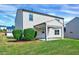 Back exterior view featuring a well maintained lawn, patio, and two story home at 2540 Averon Dr, Fuquay Varina, NC 27526