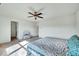 Bedroom with ceiling fan and adjacent bathroom providing a private retreat space at 2540 Averon Dr, Fuquay Varina, NC 27526