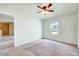 Bright bedroom featuring neutral paint, wall-to-wall carpeting, a closet, and a window at 2540 Averon Dr, Fuquay Varina, NC 27526