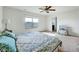 Bright bedroom features a ceiling fan, large window and ensuite bathroom for added privacy and convenience at 2540 Averon Dr, Fuquay Varina, NC 27526