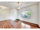 Spacious entryway with gleaming hardwood floors and a globe pendant light at 2540 Averon Dr, Fuquay Varina, NC 27526