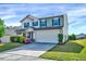 Attractive two-story home with a two-car garage, front yard, and colorful flowering bushes at 2540 Averon Dr, Fuquay Varina, NC 27526