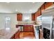 Modern kitchen with granite countertops, stainless steel appliances, and hardwood floors at 2540 Averon Dr, Fuquay Varina, NC 27526