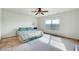 Main bedroom with bed, ceiling fan, large window and neutral colored walls at 2540 Averon Dr, Fuquay Varina, NC 27526