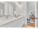 Bathroom with double sinks and vanity, with a bedroom visible in background at 2615 Bedford Ave, Raleigh, NC 27607