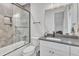 Stylish bathroom features a gray herringbone tile surround and frameless glass shower door at 2615 Bedford Ave, Raleigh, NC 27607