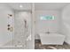 Chic bathroom features a luxurious shower and a modern soaking tub at 2615 Bedford Ave, Raleigh, NC 27607