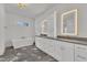 Well-lit bathroom features marble floors, double vanities and free standing tub at 2615 Bedford Ave, Raleigh, NC 27607