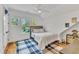 Bright bedroom with a ceiling fan, a large window and a stylish rug at 2615 Bedford Ave, Raleigh, NC 27607