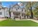 Charming two-story home featuring a welcoming front porch, manicured lawn, and beautiful stone accents at 2615 Bedford Ave, Raleigh, NC 27607
