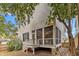 Two-story home's exterior features a porch, stairs, and access to the backyard at 2615 Bedford Ave, Raleigh, NC 27607