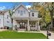 Charming two-story home featuring a welcoming front porch, manicured lawn, and beautiful stone accents at 2615 Bedford Ave, Raleigh, NC 27607