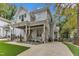 Charming two-story home featuring a welcoming front porch, manicured lawn, and beautiful stone accents at 2615 Bedford Ave, Raleigh, NC 27607