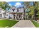 Charming two-story home featuring a welcoming front porch, manicured lawn, and beautiful stone accents at 2615 Bedford Ave, Raleigh, NC 27607